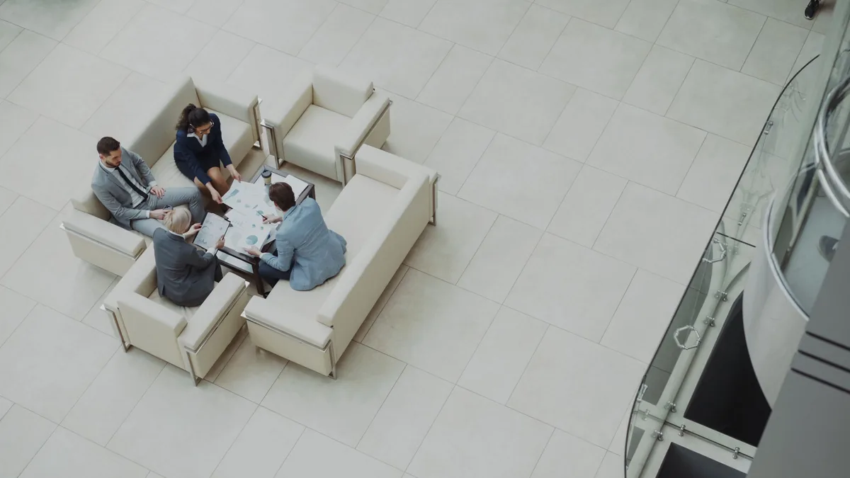 Small business team reviewing documents together at a table